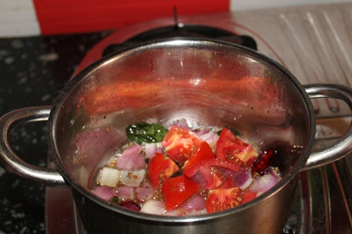 add tomatoes to onions