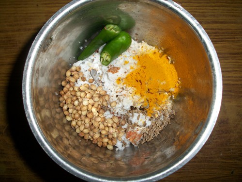 take coconut, coriander seeds, cumin seeds, green chillies and turmeric powder