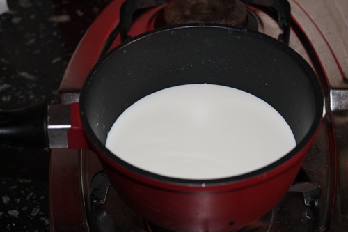 take milk in a sauce pan for cooking oats