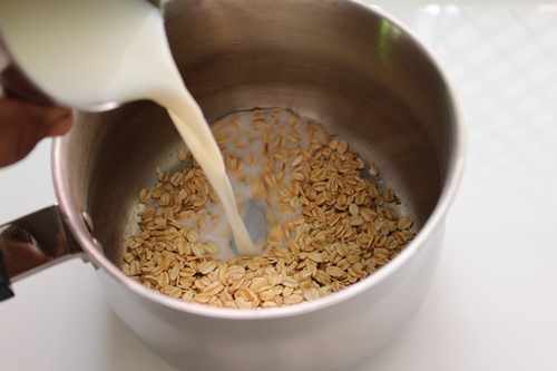 take rolled oats in a sauce pan with milk