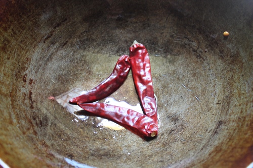 add dry red chillies to kadai