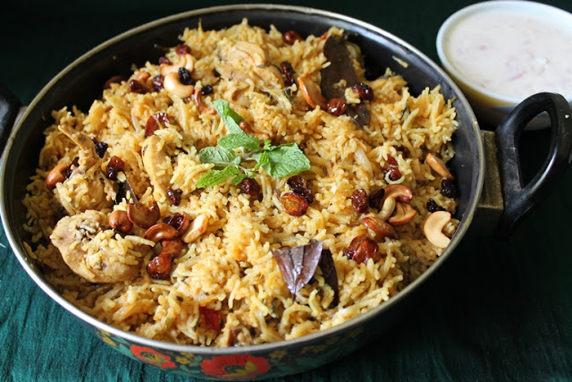 Pressure Cooker Chicken Biryani garnished with fried nuts