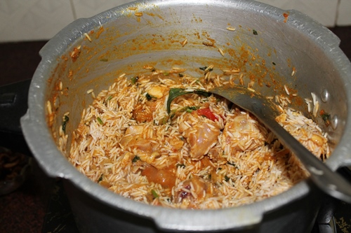 toss rice with chicken masala