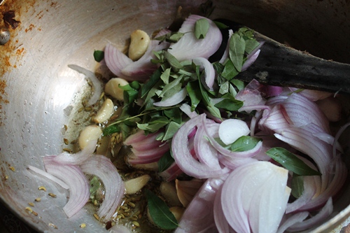 add sliced onions, curry leaves and green chillies
