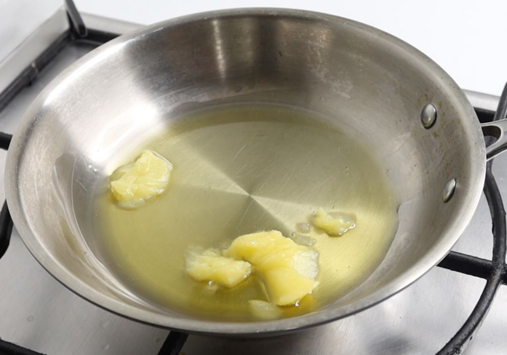 heat ghee in a pan for tempering