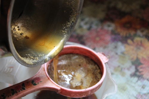 strain the jaggery through a sieve