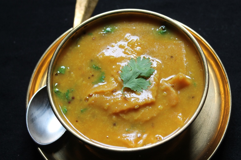 dal dhokli served with coriander leaves