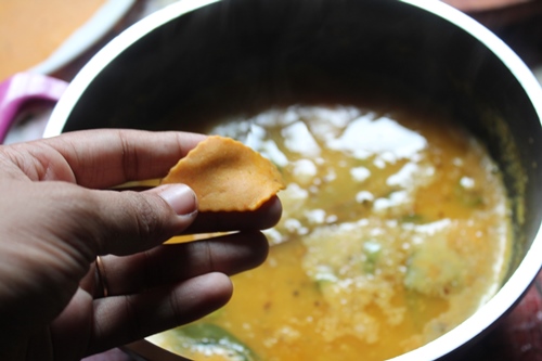 add rolled cut dhokli one by one as dal is boiling