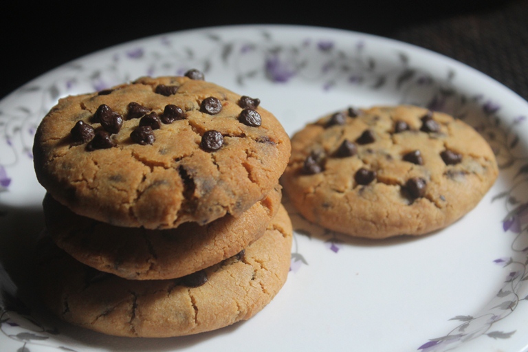 Eggless Chocolate Chip Cookies baked and stacked