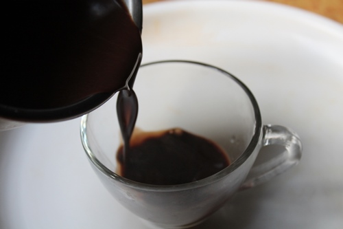 pouring hot chocolate in a mug