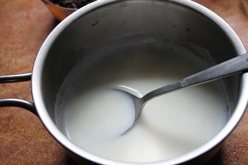 simmer full fat milk in a sauce pan