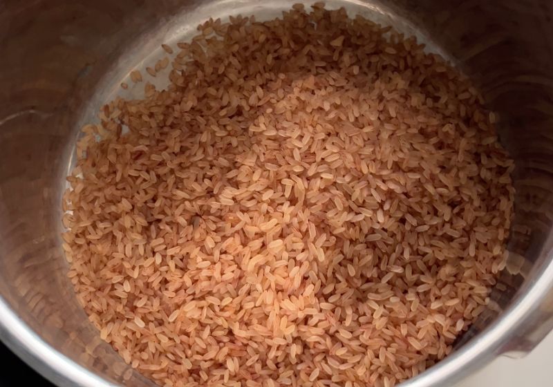 take kerala red rice in a pressure cooker
