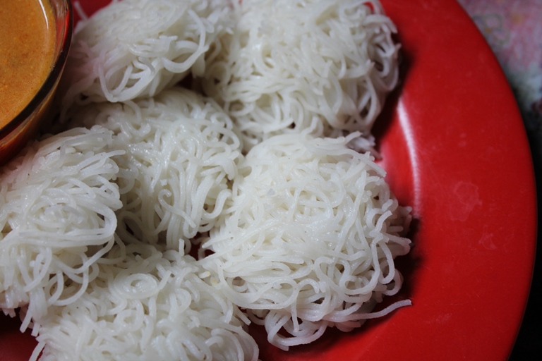 soft idiyappam served on a red plate