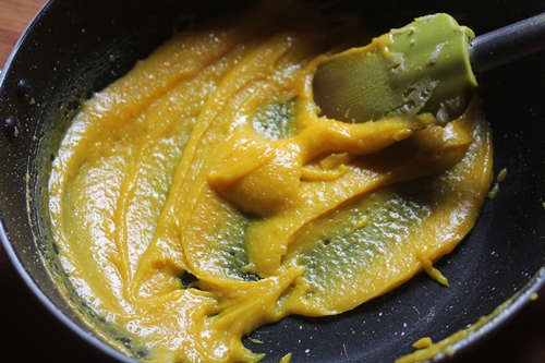 khoya with sugar and saffron colour added