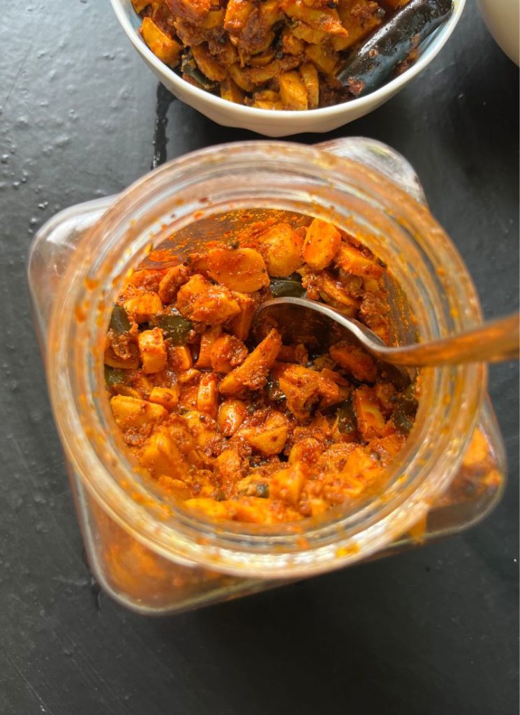 mango ginger pickle stored in glass bottle