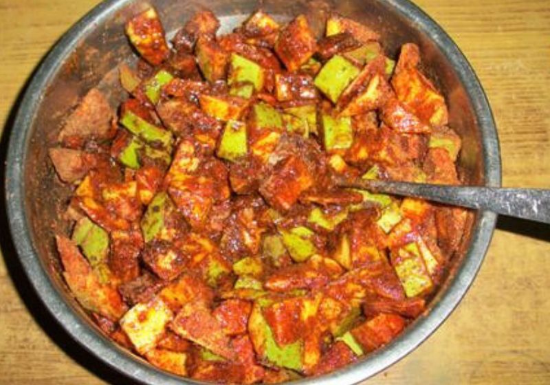 mango pickle mixed with spices and salt
