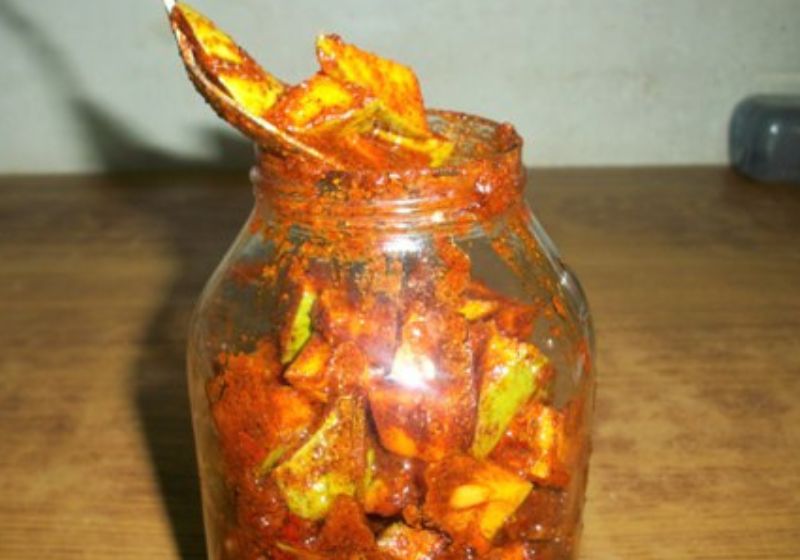 spoon mango pickle in glass jar