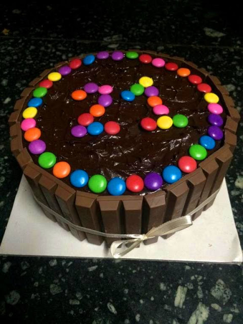 mud cake decorated with kit kat bars, m&ms for birthday