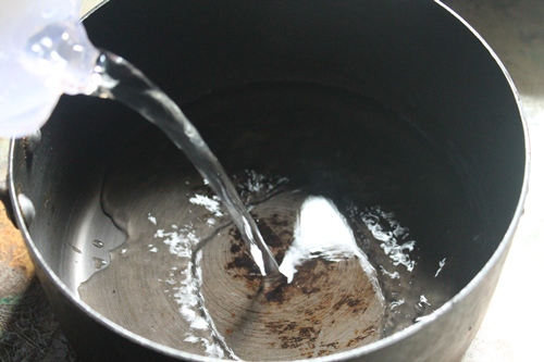 take water in a sauce pan