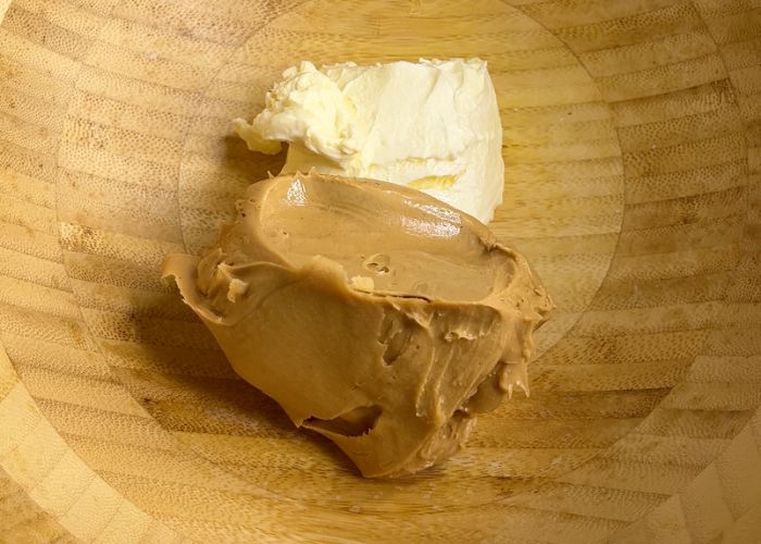 take peanut butter and cream cheese in a bowl