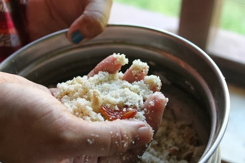 take small portions of rava ladoo mix