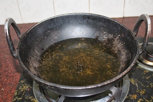 heat oil in a iron kadai
