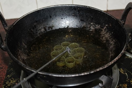 dip rose cookies mould in hot oil
