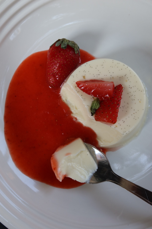 a spoon of soft set vanilla panna cotta