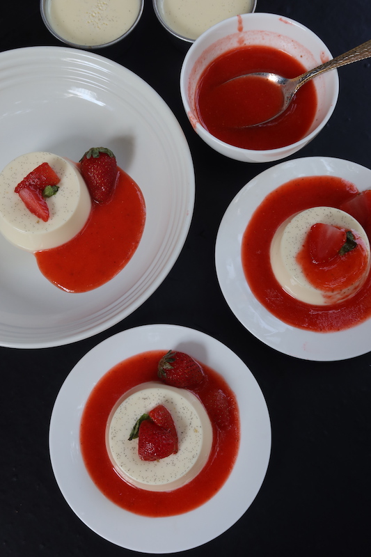 vanilla panna cotta served with strawberry sauce