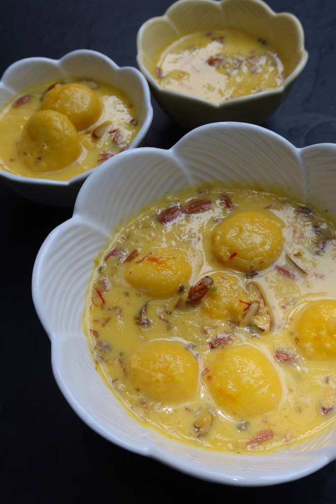 kesar rasmalai garnished with nuts