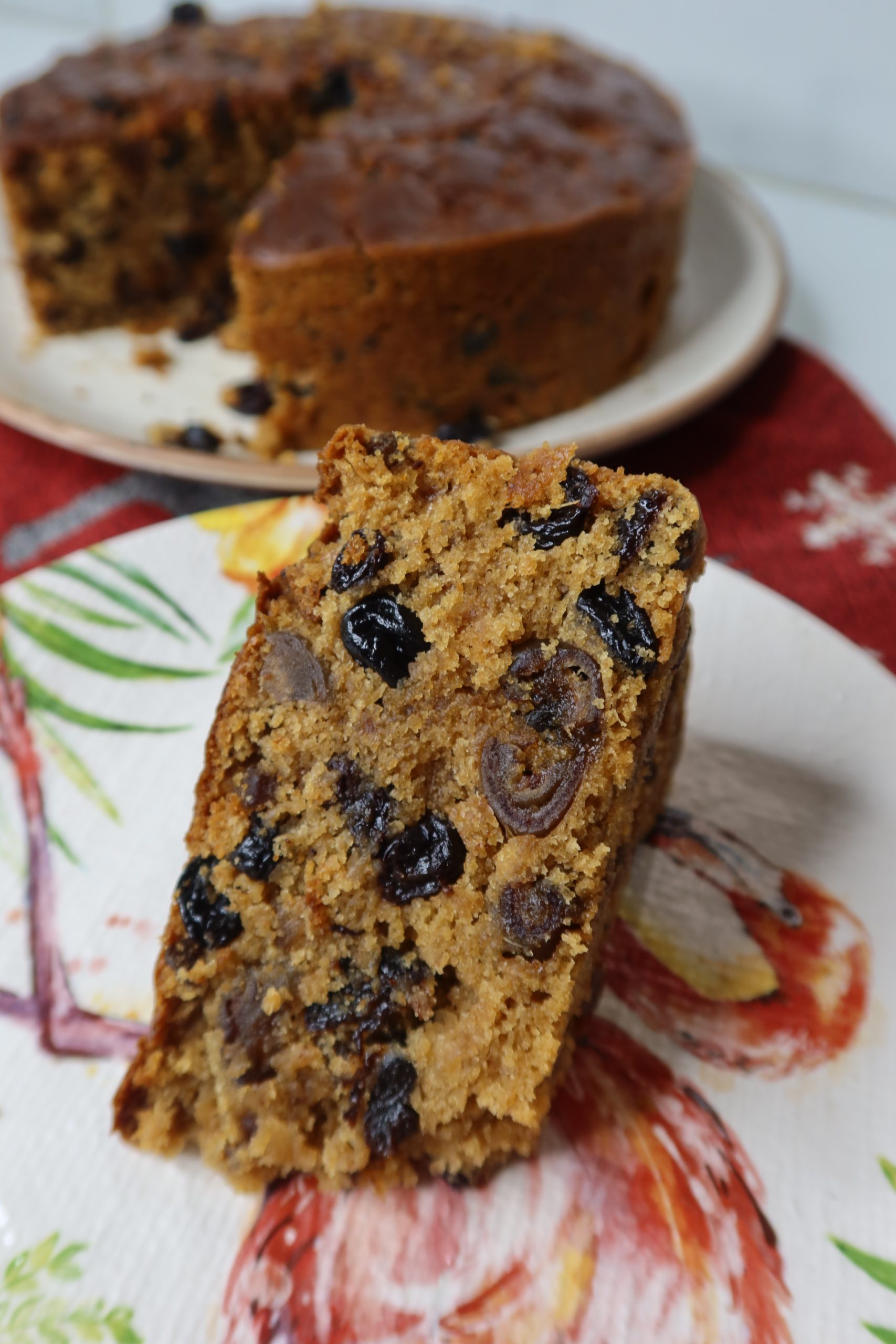 a slice of moist eggless fruit cake