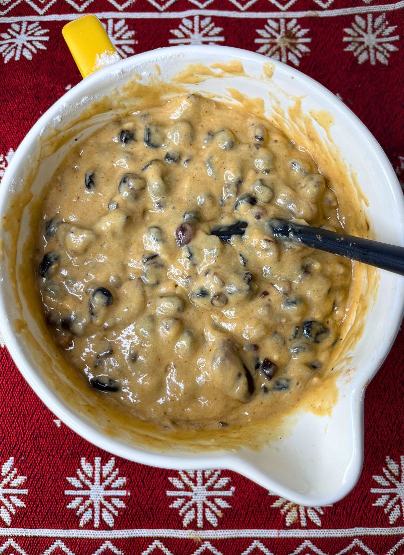 eggless fruit cake batter in a yellow mixing bowl