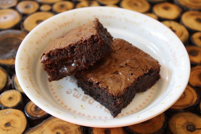 fudgy brownies served in a white dish