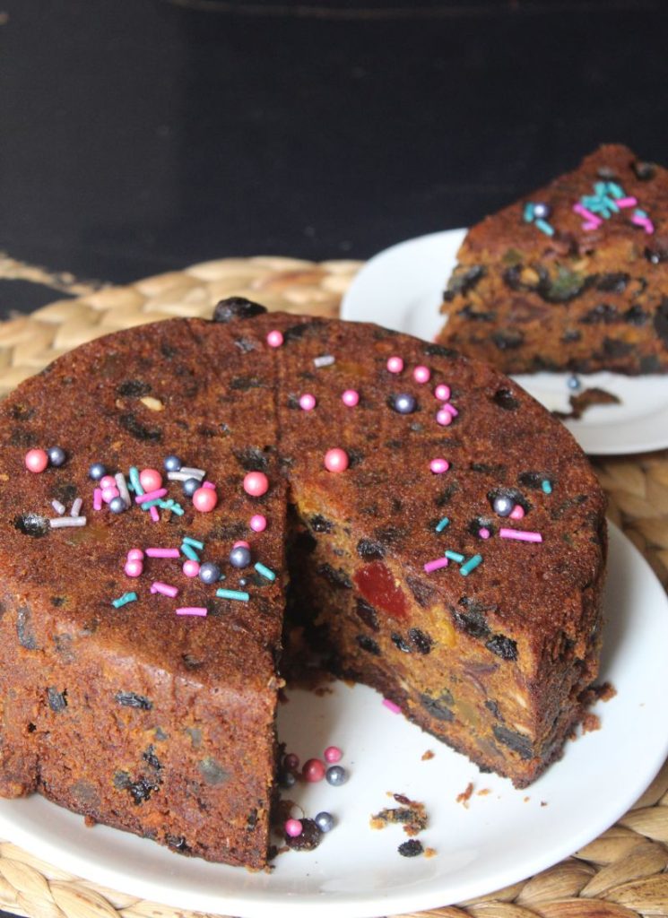 whole plum cake sliced in serve