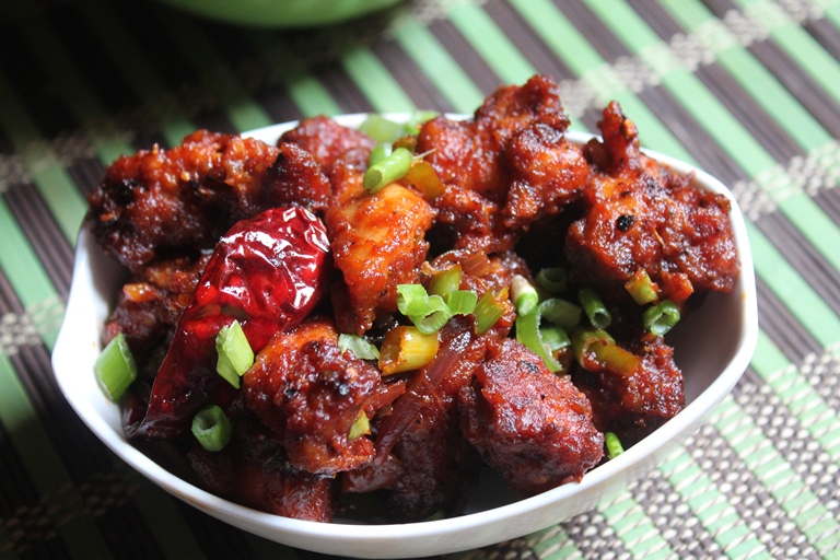 chilli chicken served with spring onions