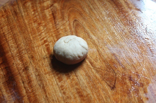 poori dough on a greased work surface