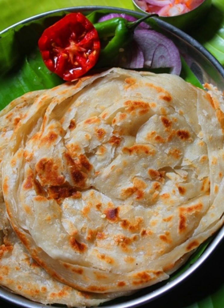 close shot of crispy flaky parotta