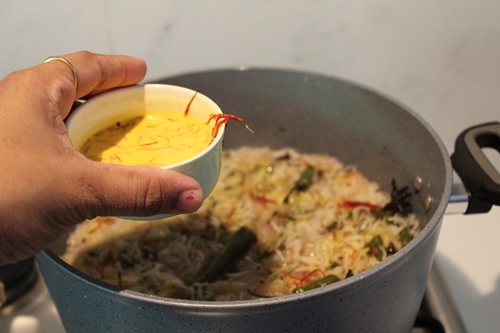 pour the saffron milk over rice.