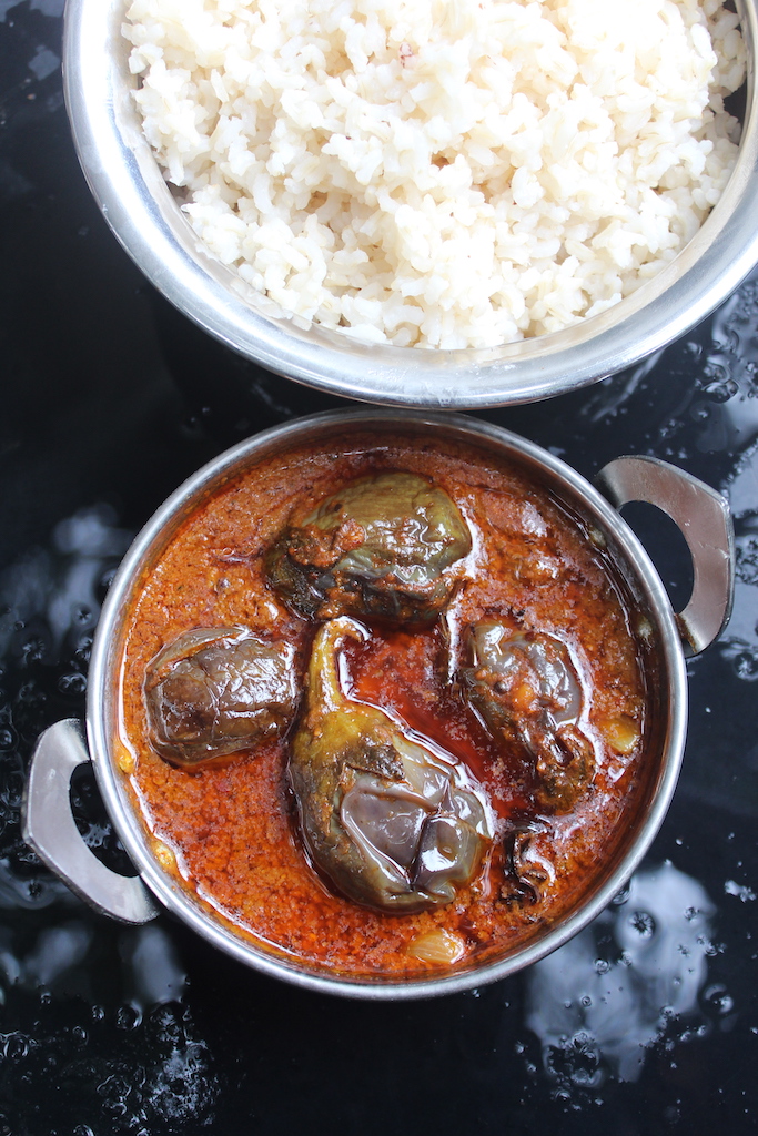 top shot of ennai kathirikai kulambu served with steamed rice