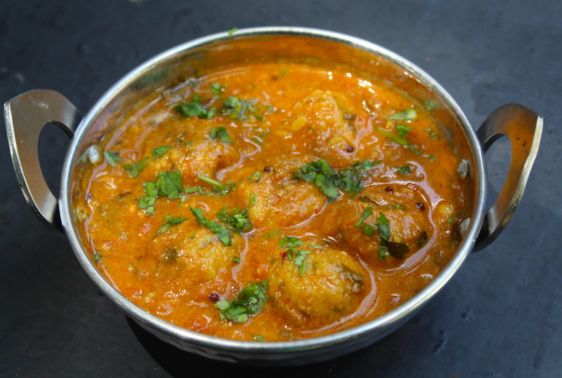 paruppu urundai kuzhambu served in a steel karahi