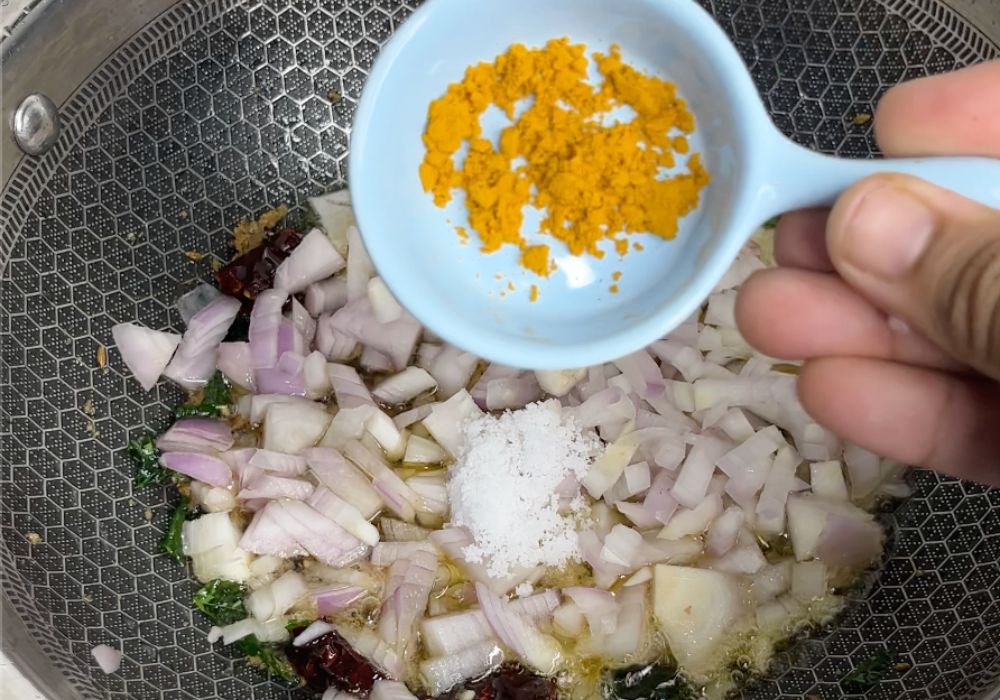 add salt and turmeric powder