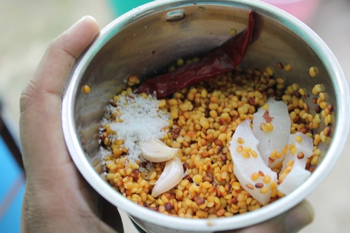 grind moong dal mix with garlic, coconut and chillies
