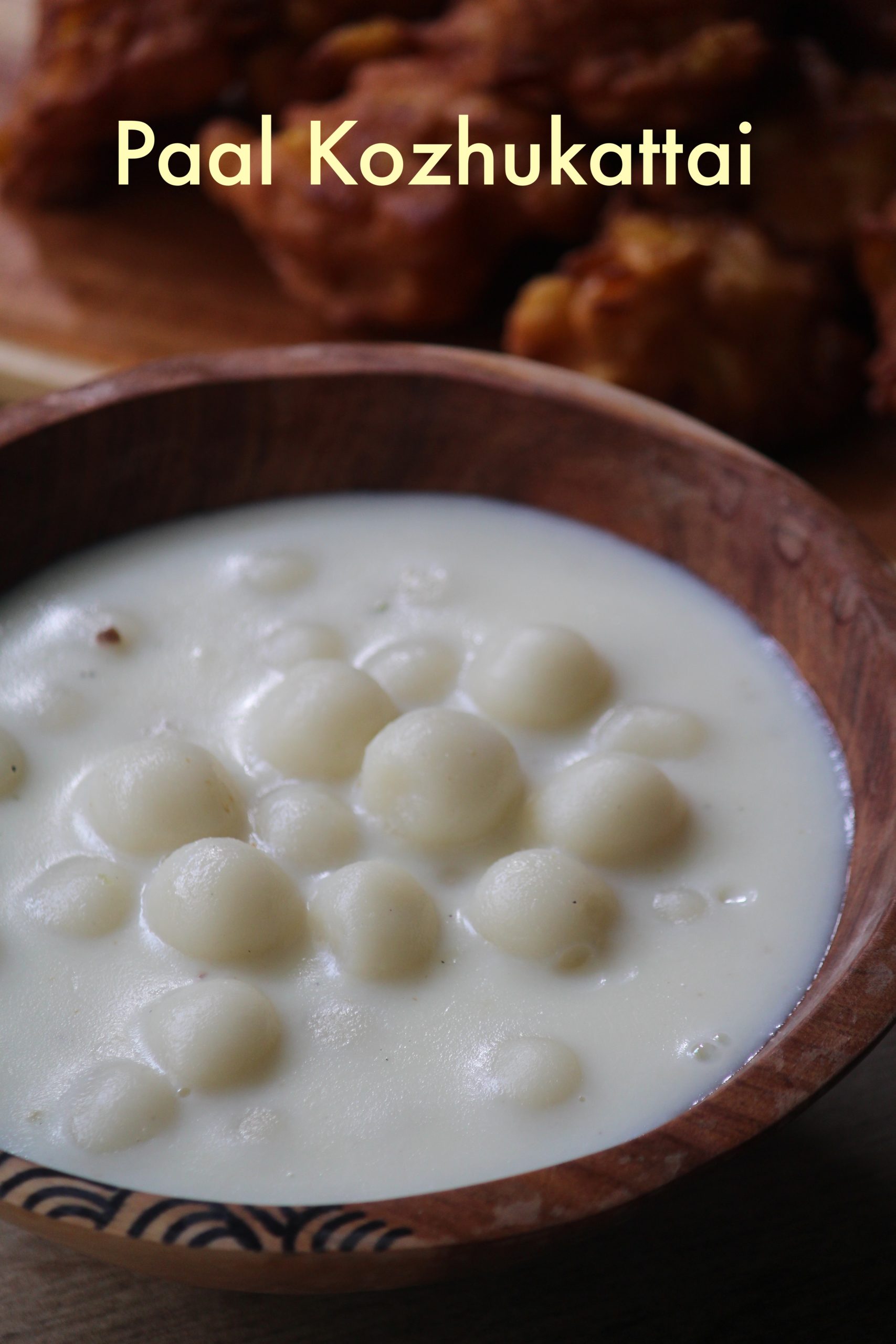 paal kozhukattai served in a wooden serving bowl