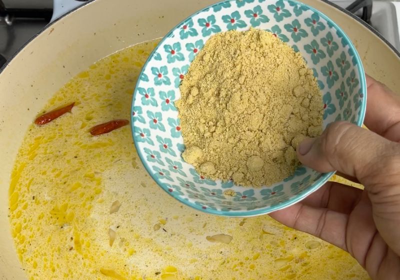 add parmesan cheese into the cream milk sauce for chicken alfredo 