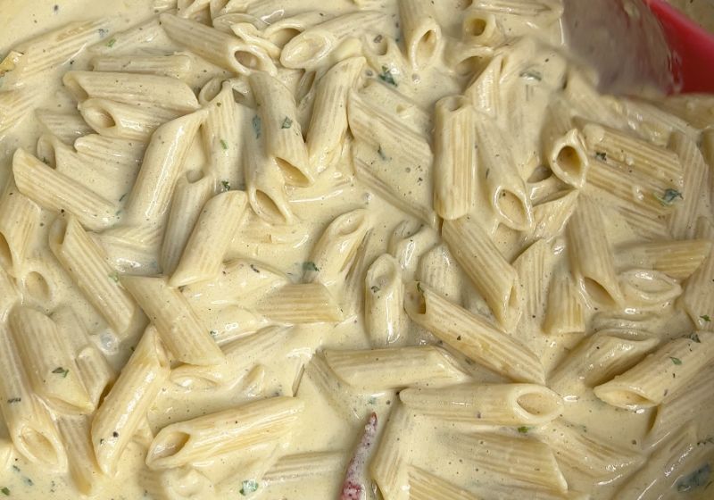 toss to coat the pasta with alfredo sauce