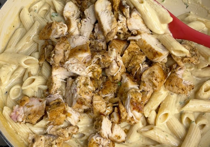 add cooked chicken into the alfredo sauce