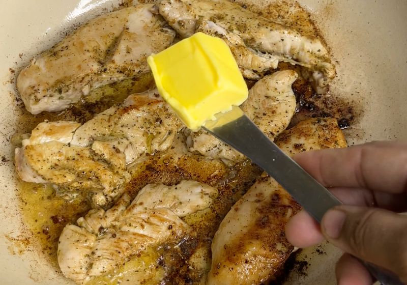 flip chicken over and add butter for chicken alfredo pasta