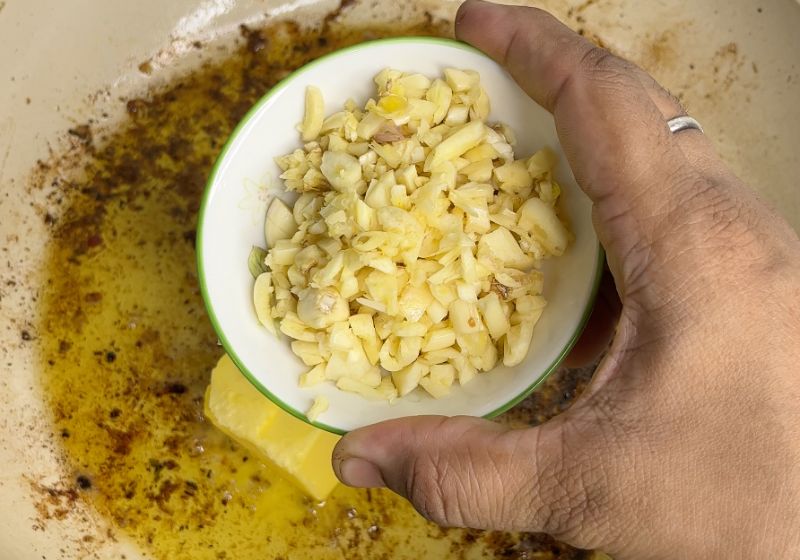 add chopped garlic into the butter for chicken alfredo 
