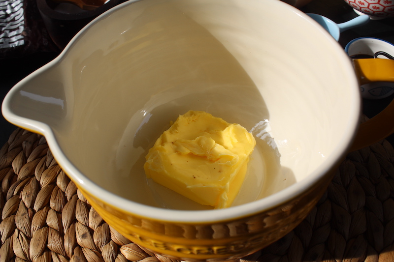 take butter in a yellow mixing bowl