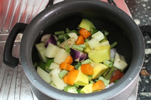 add mixed vegetables to onions